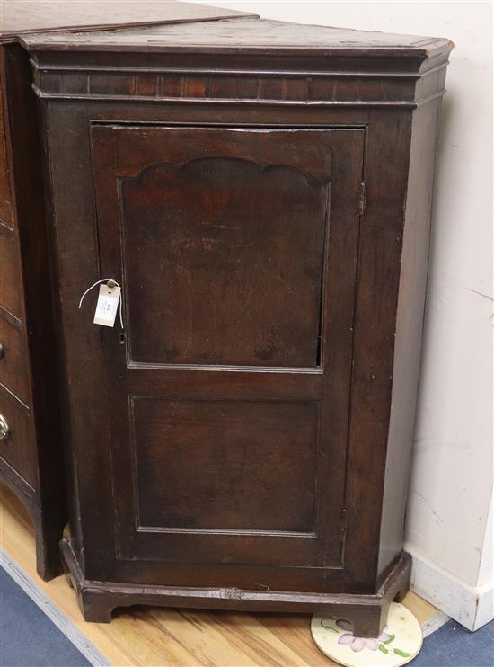 A George III oak and mahogany corner cabinet H.114cm